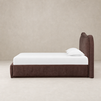 Plush Laughlin Plum bed with a curved headboard and clean lines.