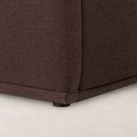 Close-up of Laughlin Plum bed’s upholstered fabric and sturdy base.
