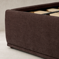Plush Laughlin Plum bed showcasing a textured upholstery and sturdy wooden slat support.