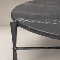 Rhea Coffee Table featuring a sleek grey Italian marble top and elegant metal legs.