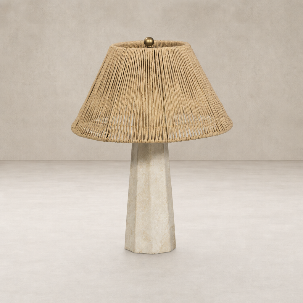 Cream Italian marble table lamp with a natural woven rattan shade.