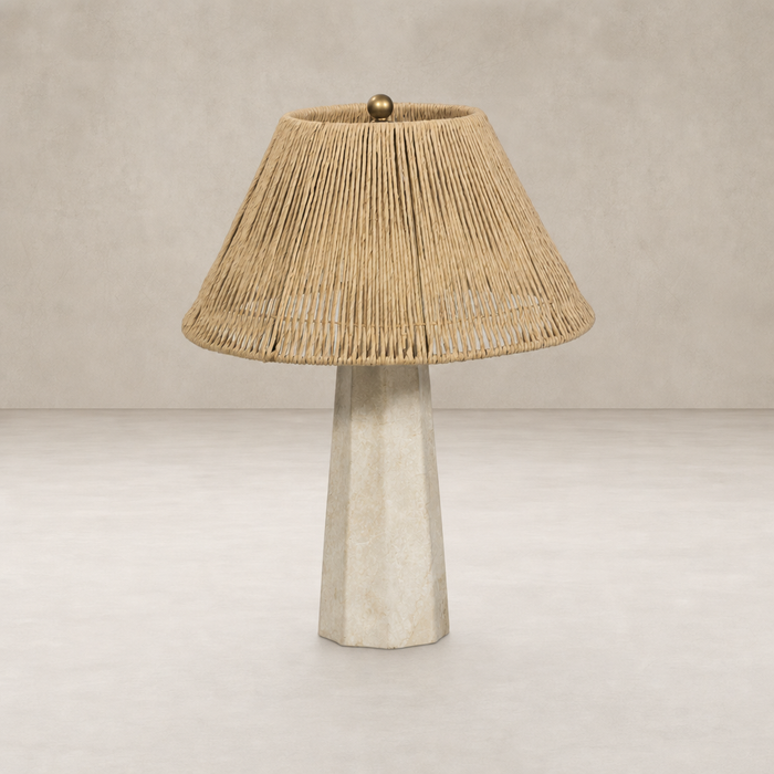 Cream Italian marble table lamp with a natural woven rattan shade.
