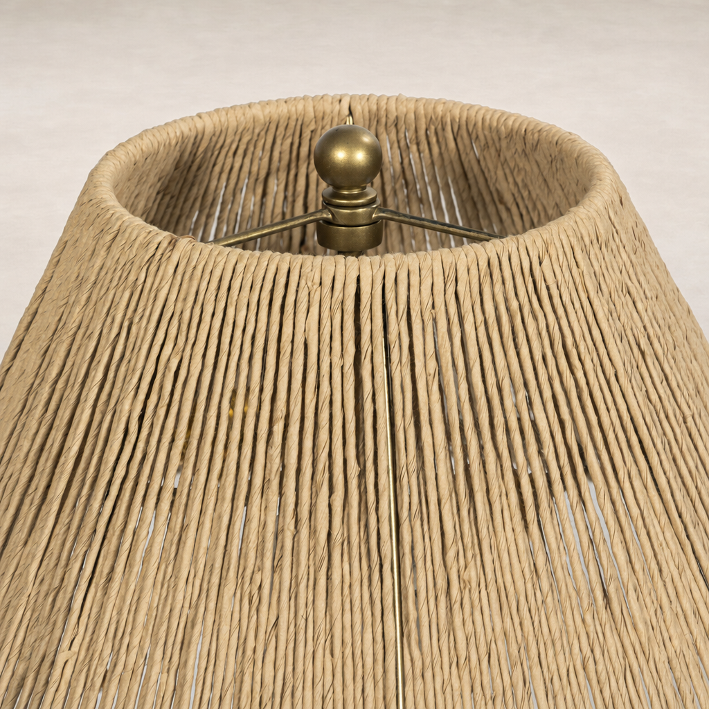 Cream Italian marble table lamp featuring a woven natural fiber shade for a warm ambiance.
