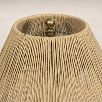 Cream Italian marble table lamp featuring a woven natural fiber shade for a warm ambiance.