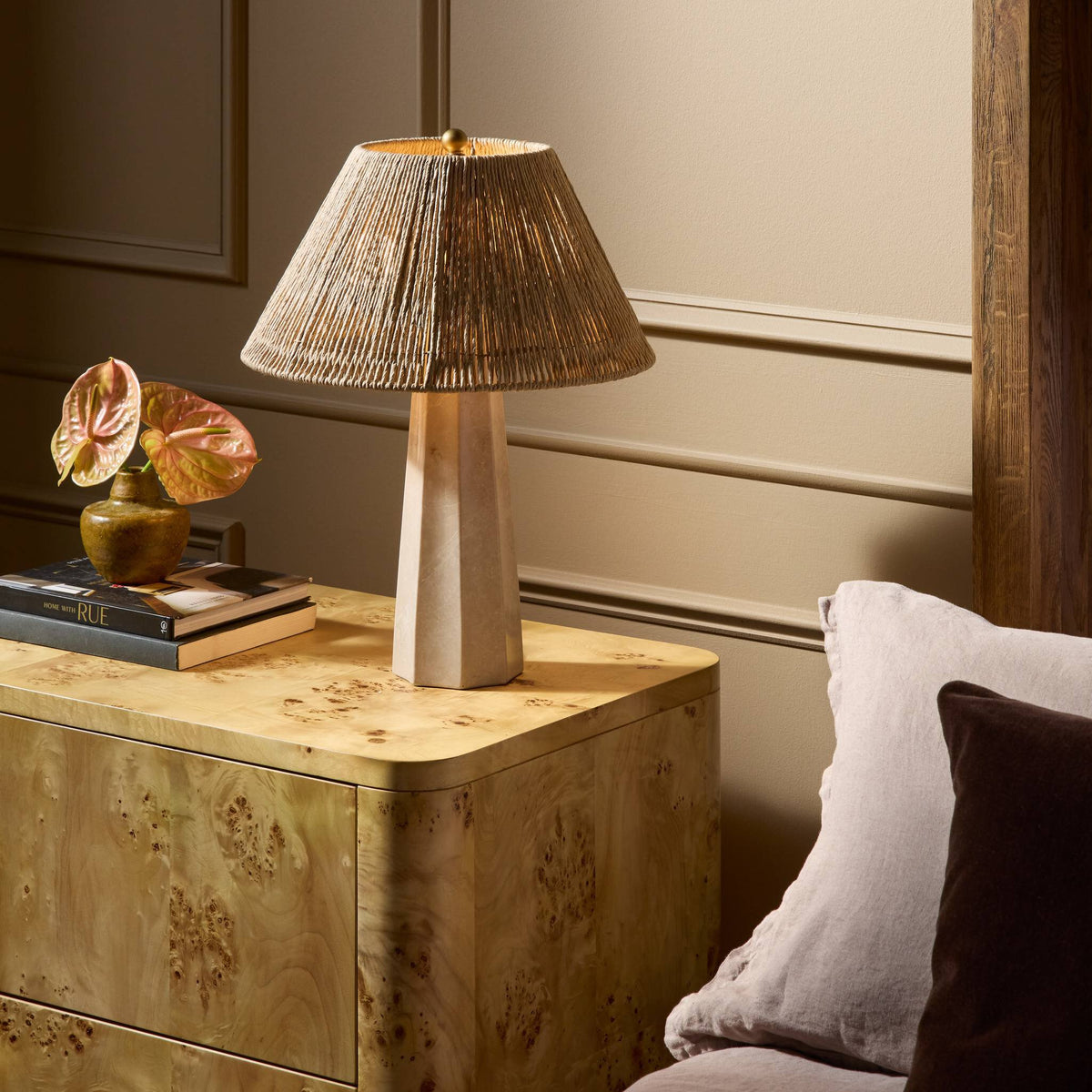Cream Italian marble table lamp with a textured shade on a bedside table.