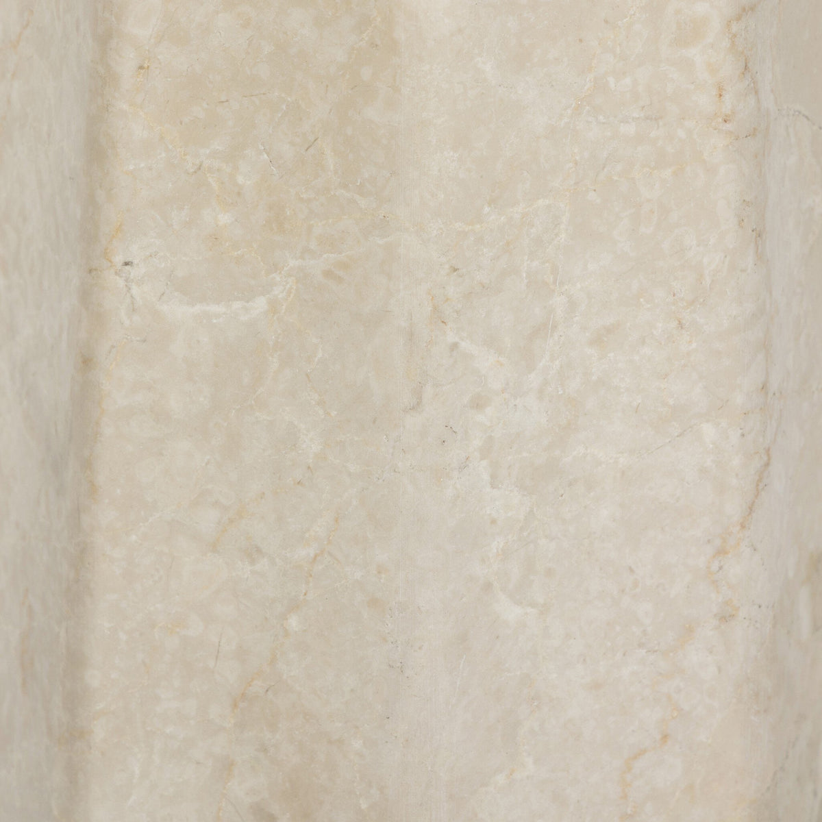 Close-up of a cream Italian marble table lamp showcasing its natural texture.