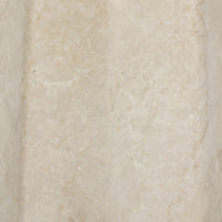 Close-up of a cream Italian marble table lamp showcasing its natural texture.