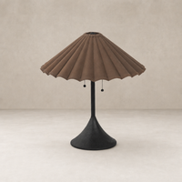 Espresso canvas table lamp with a pleated shade and slender black base.