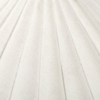 Cream canvas table lamp showcasing a textured, pleated shade design.