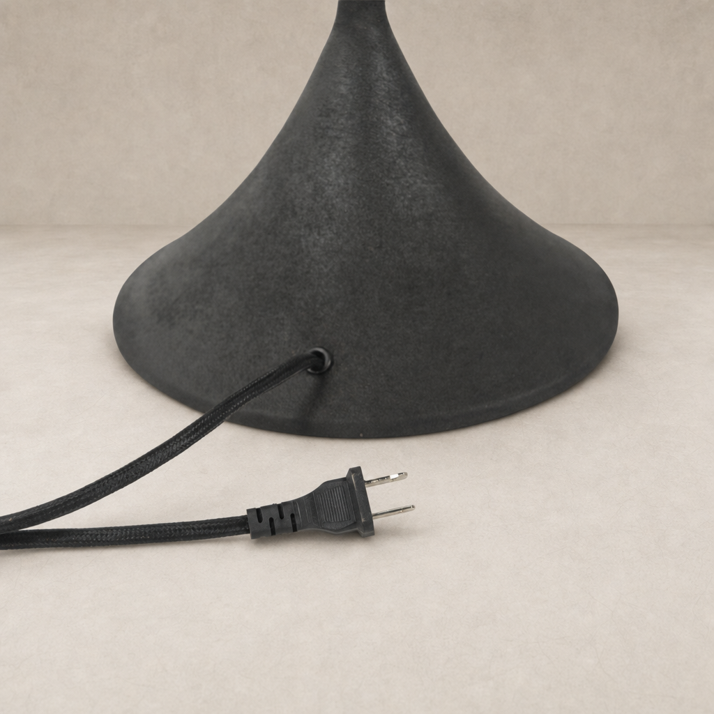 Cream canvas table lamp with a sleek black cord and base design.