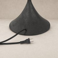 Cream canvas table lamp with a sleek black cord and base design.
