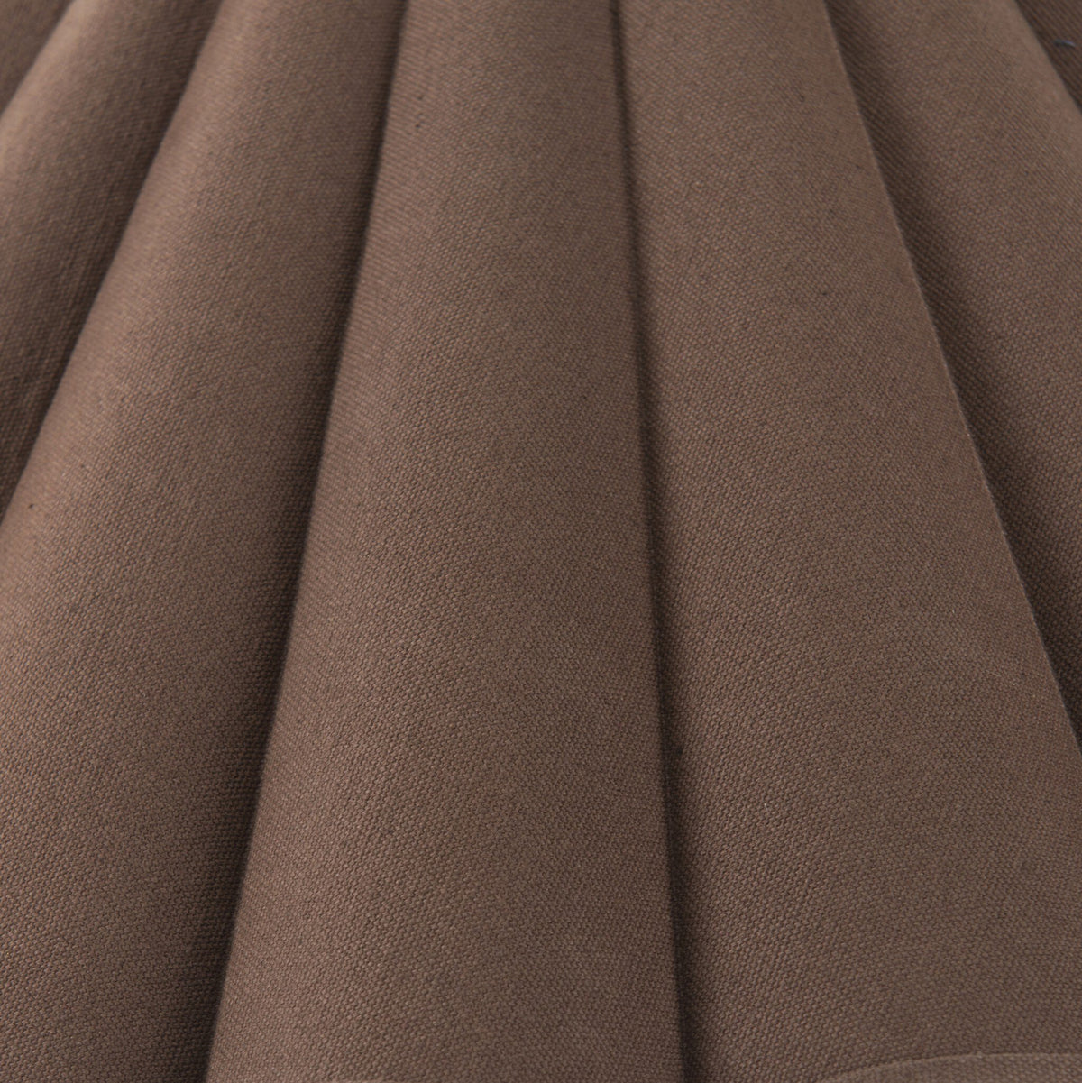 Espresso canvas fabric of a stylish floor lamp with a textured finish.