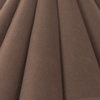 Espresso canvas fabric of a stylish floor lamp with a textured finish.