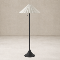 Elegant cream canvas floor lamp with a scalloped shade and sleek black base.
