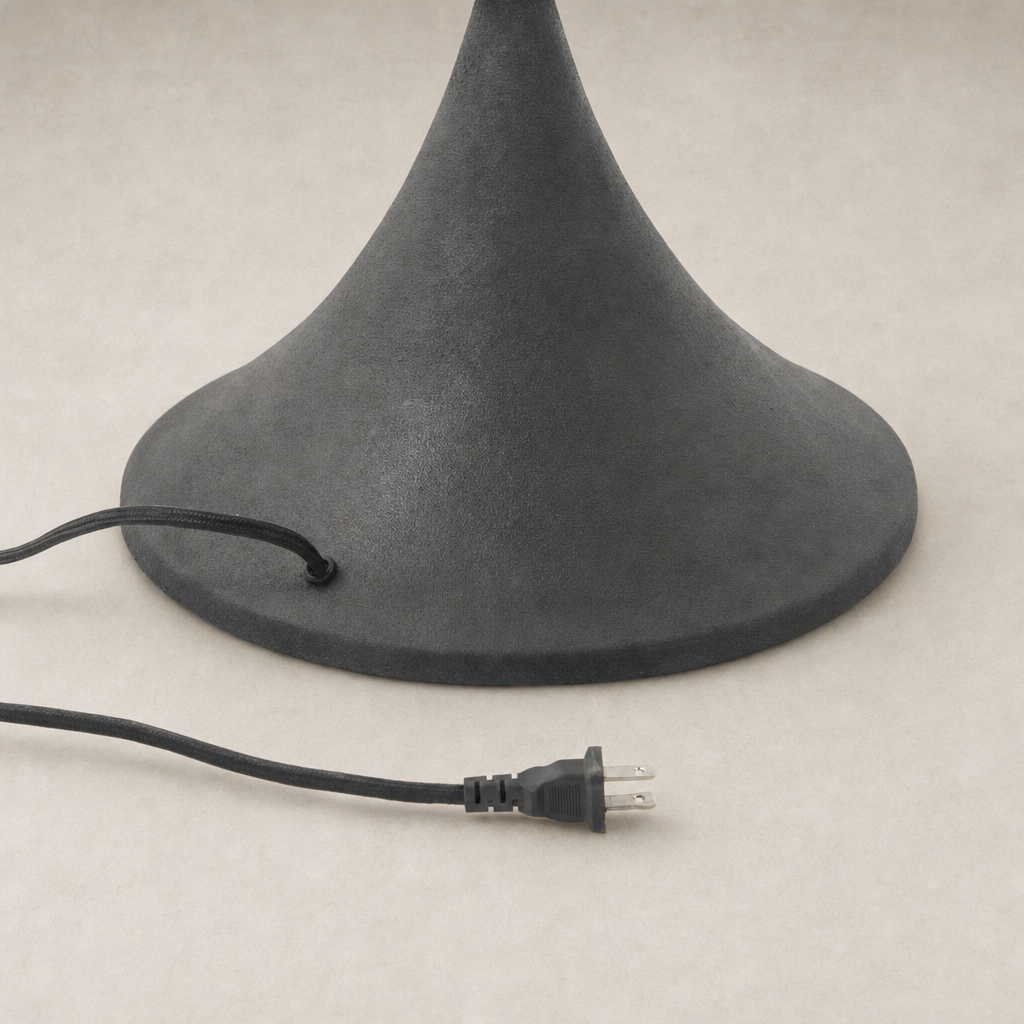 Cream canvas floor lamp with a sleek, bell-shaped black base and power cord.