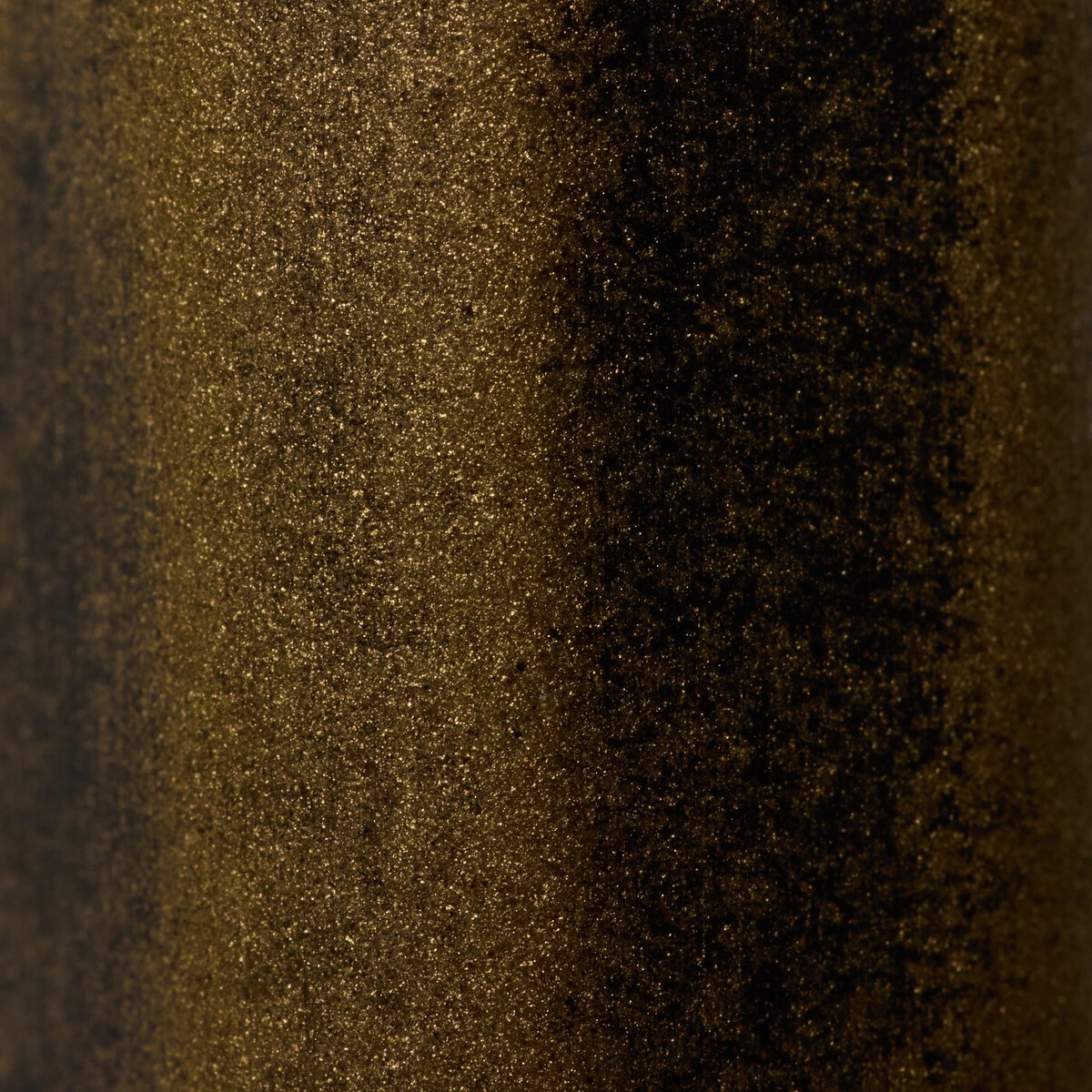 Close-up of the Winslow Shelf showcasing its textured, metallic finish and rich, dark tones.