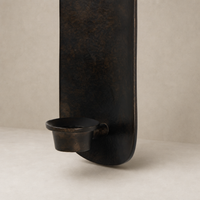 Zola Wall Mounted Candle Holder in distressed bronze featuring a sleek, modern design.