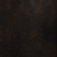 Distressed bronze texture close-up of Zola wall mounted candle holder.