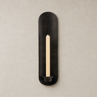 Zola Wall Mounted Candle Holder in distressed bronze, featuring a sleek oval design and holder for taper candles.