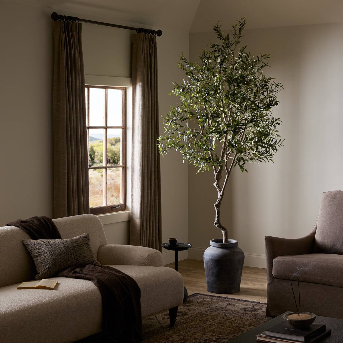 Corsica Olive Tree in a modern setting with realistic faux leaves and textured pot.