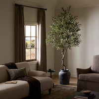 Corsica Olive Tree in a modern setting with realistic faux leaves and textured pot.