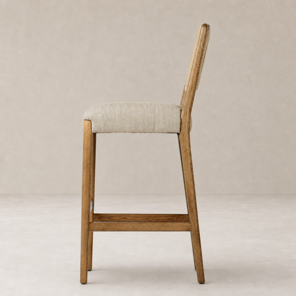 Kauri Bar + Counter Stool in Alcala Wheat featuring a sleek wood frame and comfortable cushioned seat.