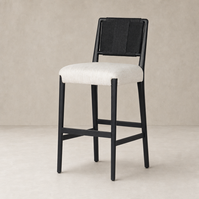 Kauri Bar + Counter Stool in Essence Natural with black frame and light fabric seat.