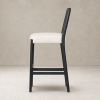 Kauri Bar + Counter Stool in Essence Natural with sleek design and comfortable upholstery.