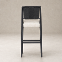 Kauri Bar + Counter Stool in Essence Natural with sleek black frame and textured backrest.