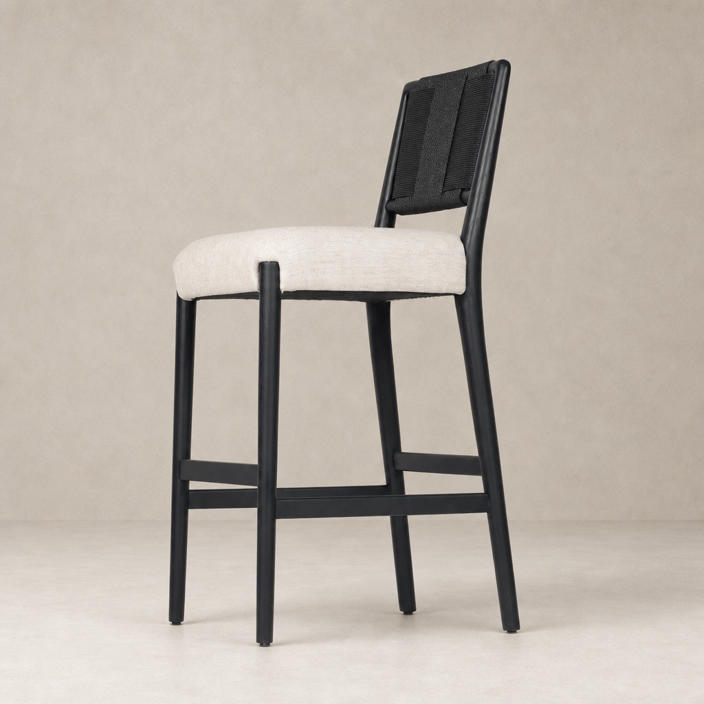 Kauri Bar + Counter Stool in Essence Natural with a sleek black frame and soft fabric seat.