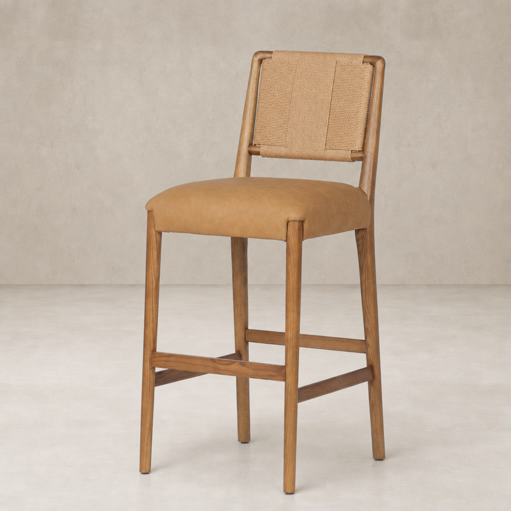 Kauri Bar + Counter Stool in Maestro Camel with a sleek wooden frame and woven backrest.