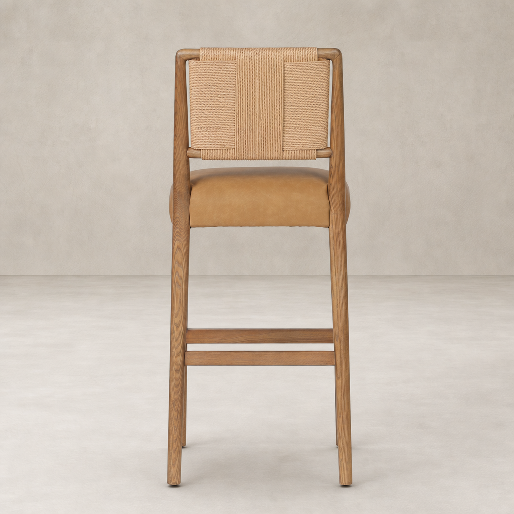 Kauri Bar + Counter Stool in Maestro Camel featuring woven backrest and wooden legs.