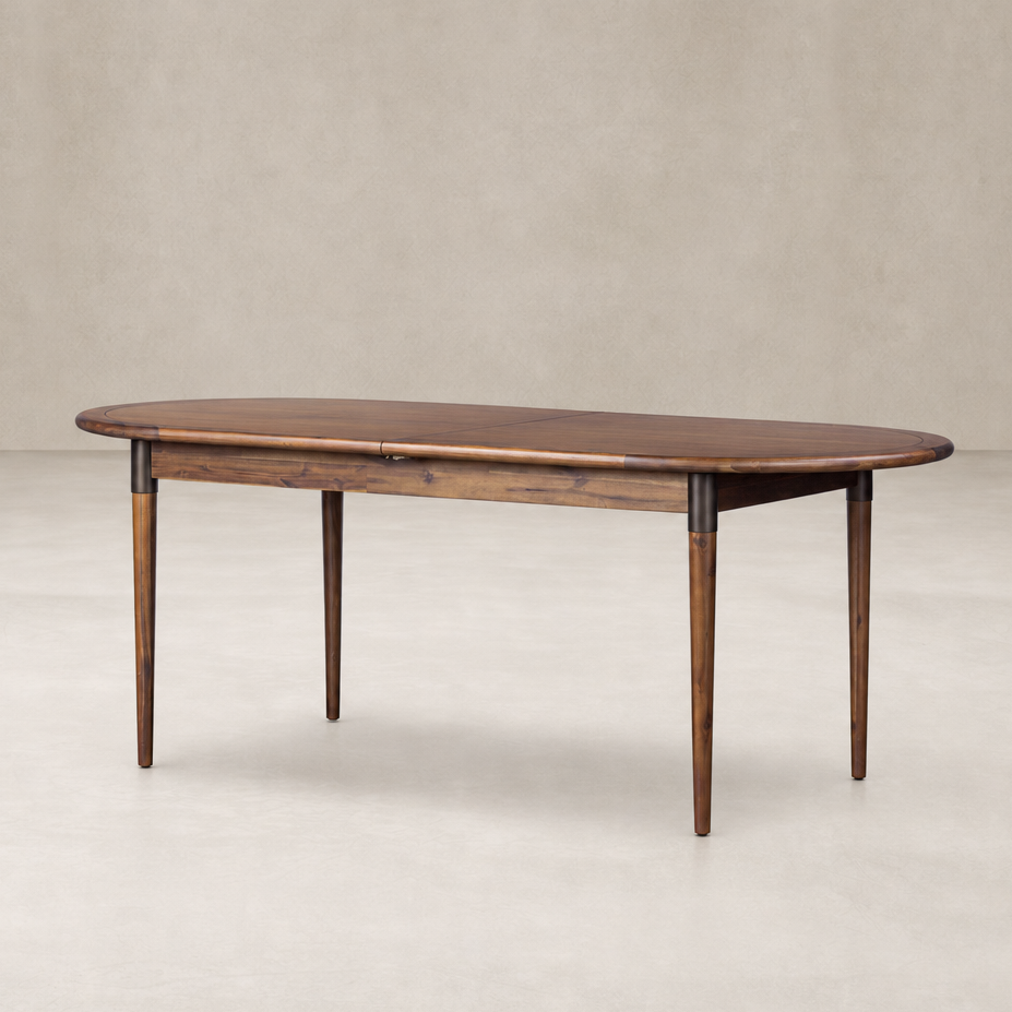 Cortina Oval Extension Dining Table in toasted walnut with elegant rounded edges.