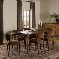 Cortina Oval Extension Dining Table in toasted walnut with elegant, curved edges and rich finish.