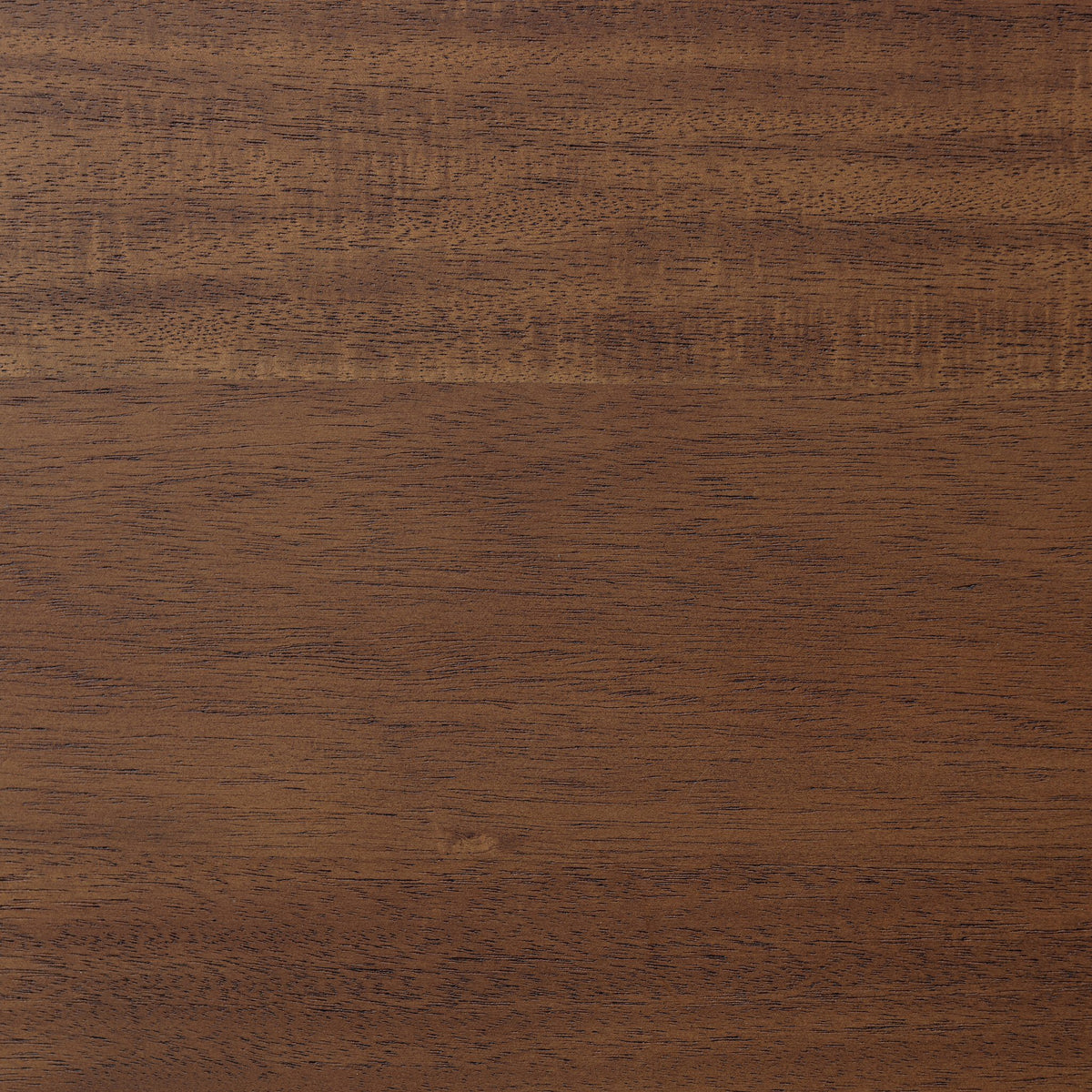 Close-up of the toasted walnut finish on the Cortina Oval Extension Dining Table.