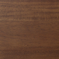 Close-up of the toasted walnut finish on the Cortina Oval Extension Dining Table.