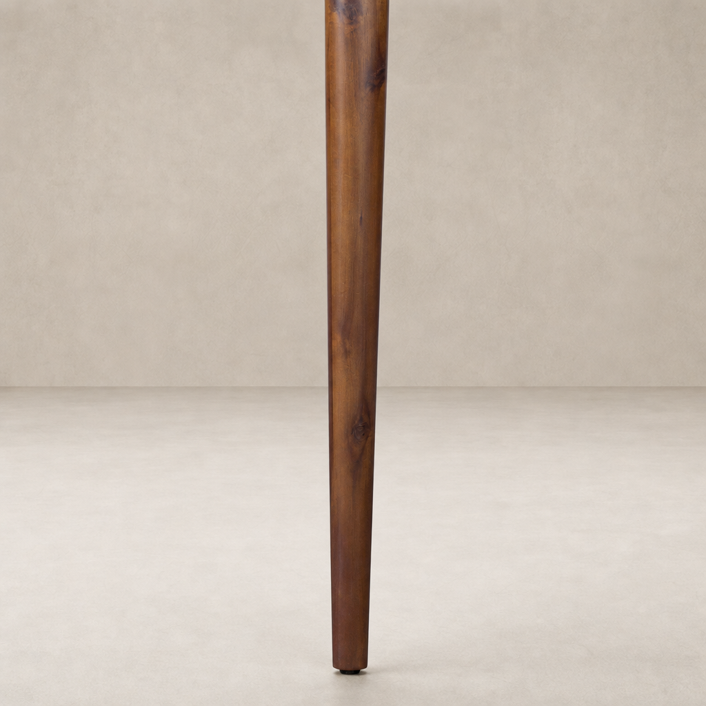 Toasted Walnut leg detail of the Cortina Oval Extension Dining Table.