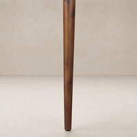 Toasted Walnut leg detail of the Cortina Oval Extension Dining Table.