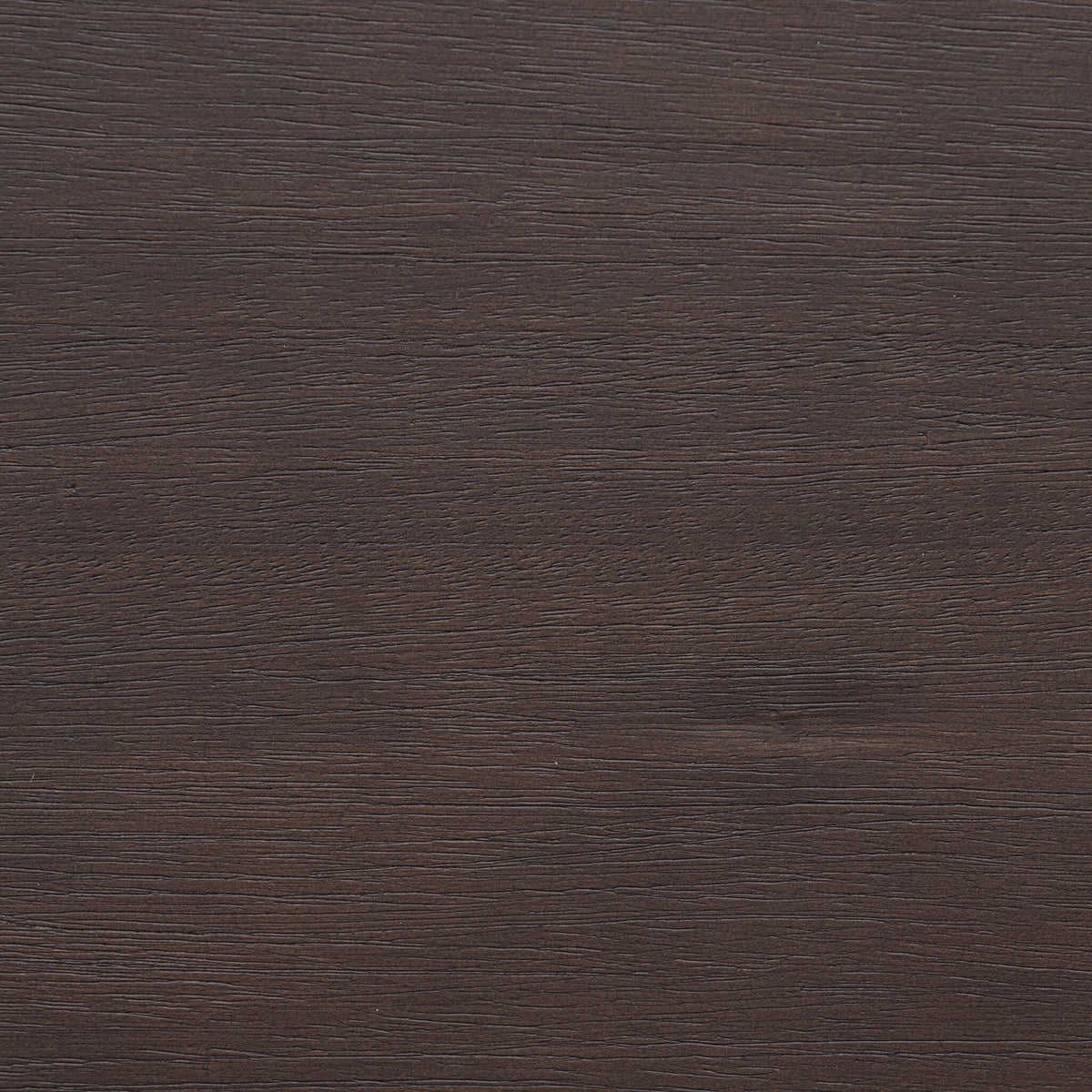 Close-up of the textured black mango finish on the Cortina Oval Extension Dining Table.
