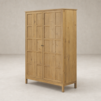Bristol Cabinet in aged natural oak with paneled doors and sturdy base.