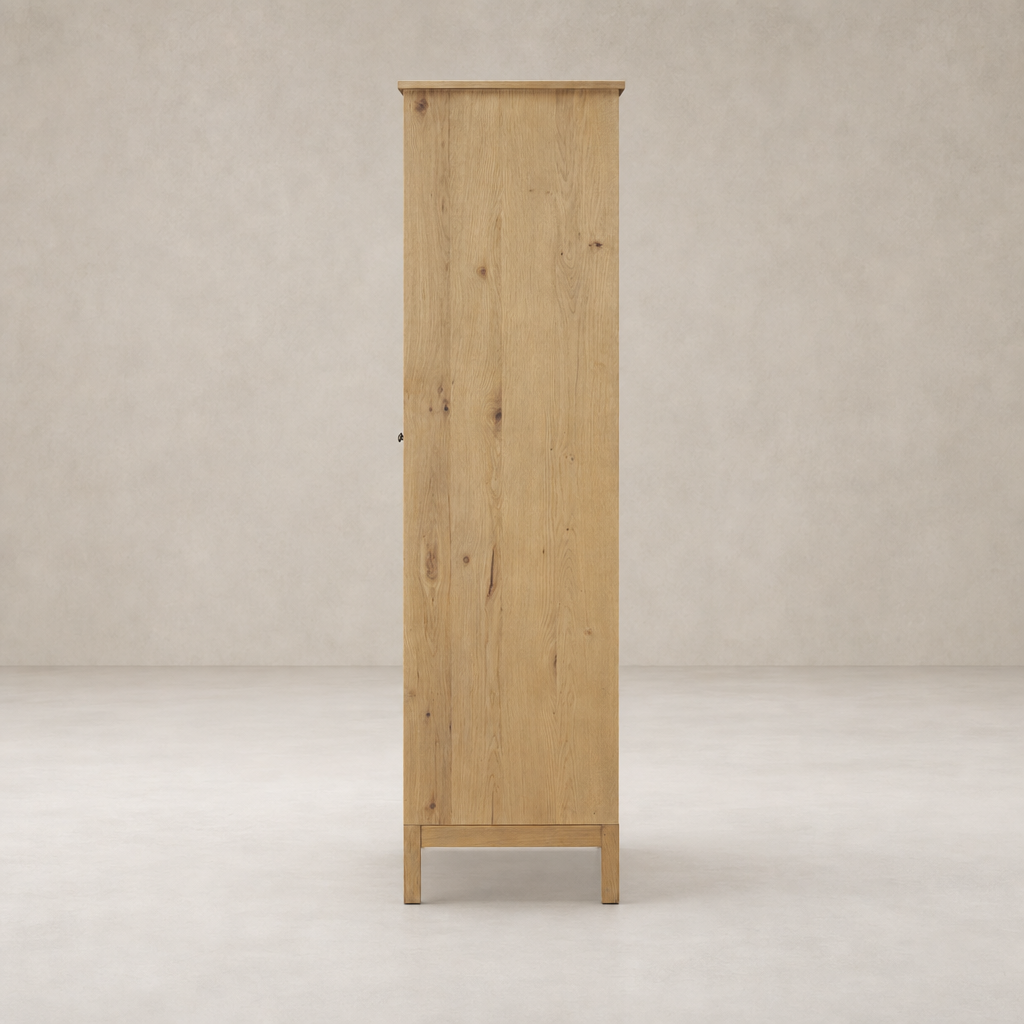 Bristol Cabinet in aged natural oak showcasing a tall, simple design with clean lines.