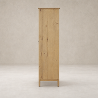 Bristol Cabinet in aged natural oak showcasing a tall, simple design with clean lines.