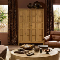 Bristol Cabinet in aged natural oak, featuring a clean, minimalist design in a stylish living room.