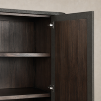 Kanoa Cabinet with dark green lacquered linen featuring sleek shelves and modern hardware.