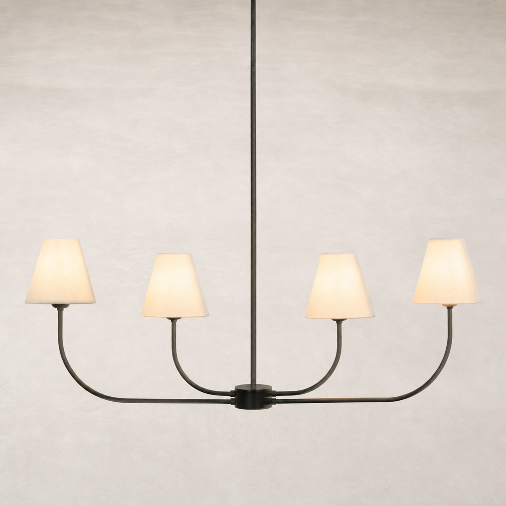 Linear chandelier in natural bronze with four cream shades and curved arms.