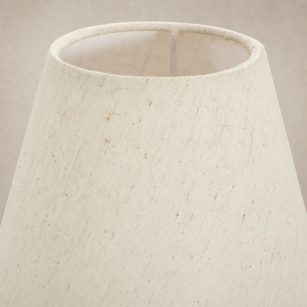 Natural bronze linear chandelier with a textured, light-colored fabric shade.