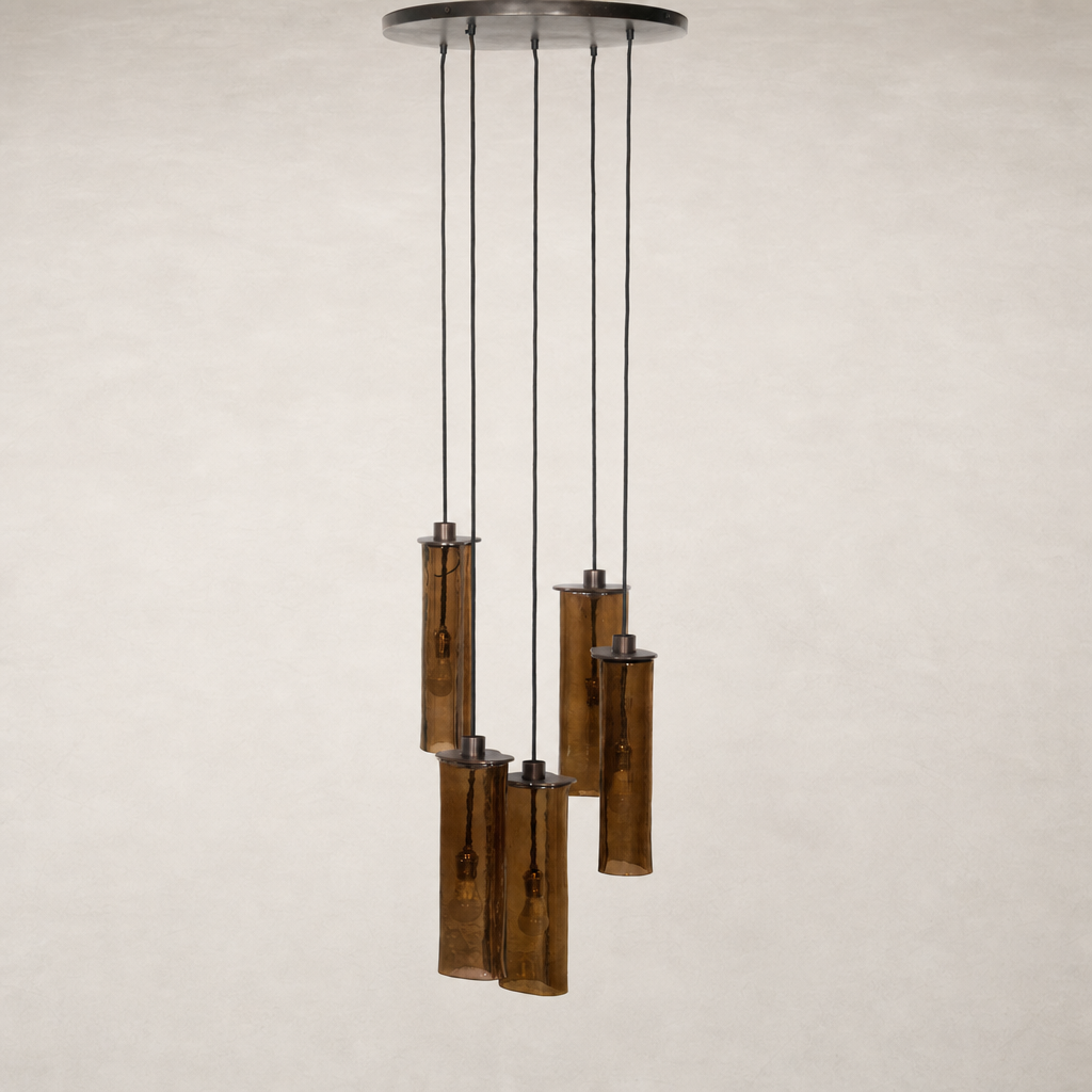 Chandelier with five textured glass tubes and black suspension cables.