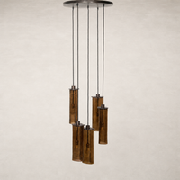 Chandelier with five textured glass tubes and black suspension cables.
