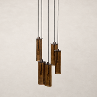 Chandelier with five textured glass tubes and black suspension cables.