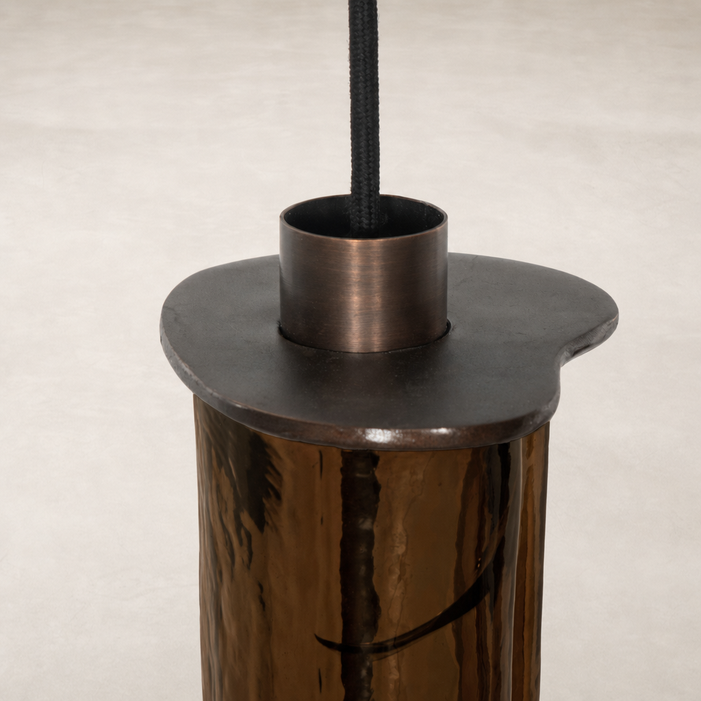 Chandelier with a sculptural design and reflective finish.